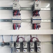 Motor starters and overload relays inside a control panel built by McClone Electric